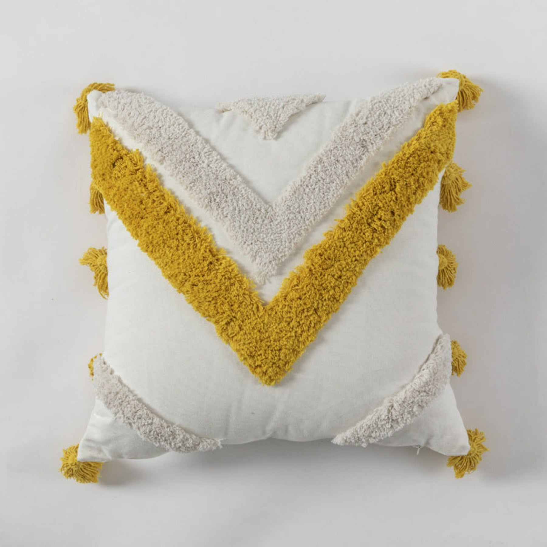 coussin blanc avec du jaune